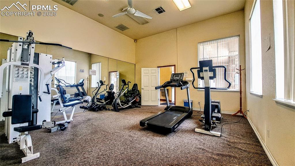 Image 34 of 36: Community clubhouse workout room