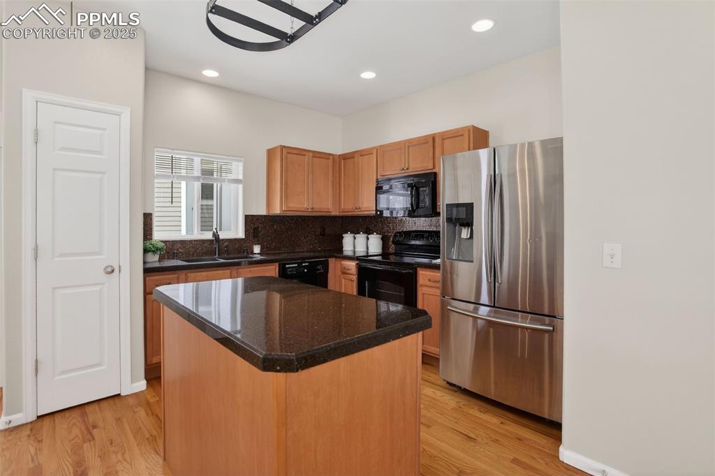 Image 10 of 36: Mosaic tiled backsplash, Italian glass granite overlay countertops, pantry,