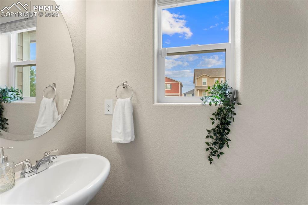 Image 10 of 26: Main level powder room.