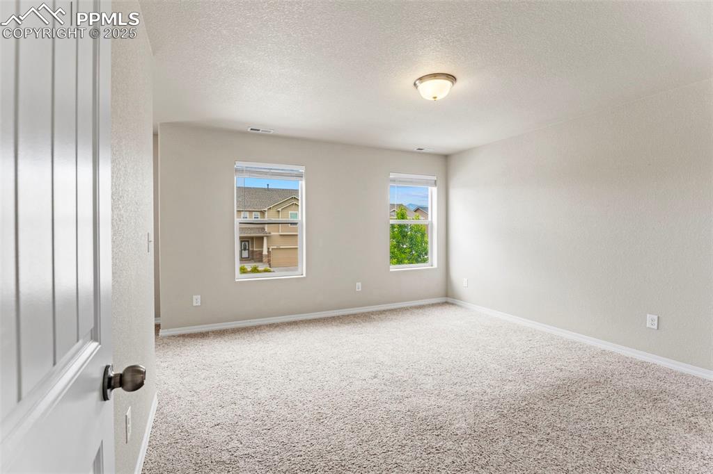 Image 13 of 26: Spacious primary bedroom with nook!