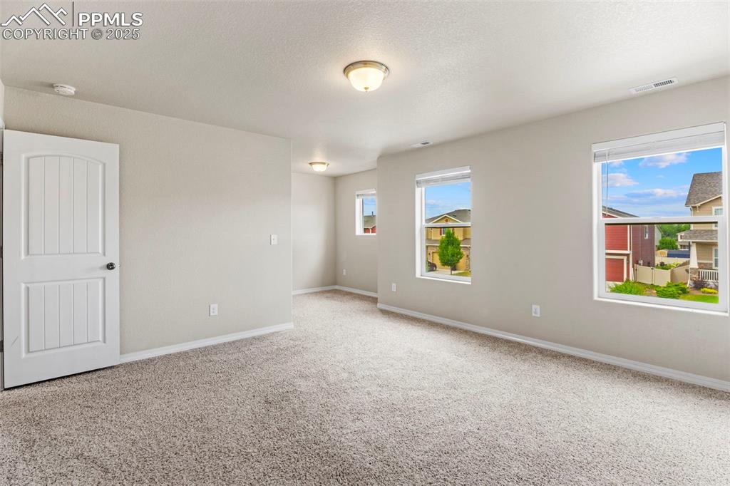 Image 14 of 26: Spacious primary bedroom with nook!