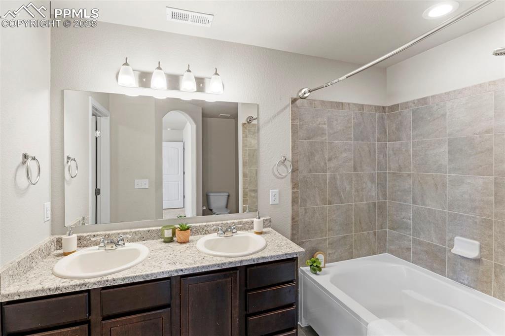 Image 16 of 26: Primary bathroom.