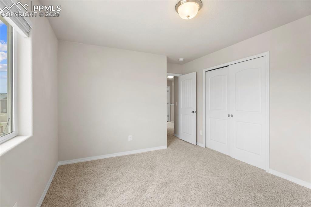 Image 21 of 26: 3rd upper level bedroom.
