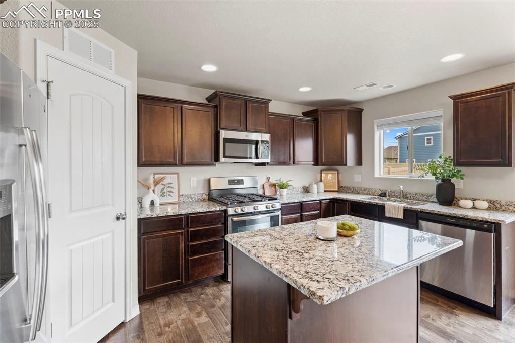 Image 6 of 26: Large pantry and granite countertops.