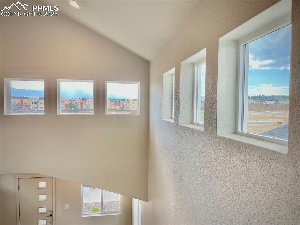 Image 22 of 23: Lots of windows for a light, bright living area