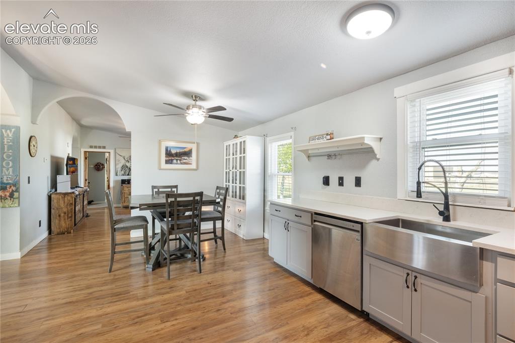 Image 10 of 36: Another view of the kitchen and that farmhouse sink, and lots of space to g