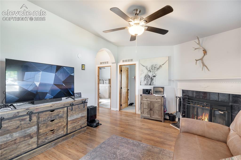 Image 14 of 36: Family Room with secondary bedrooms in the background.  These are separated