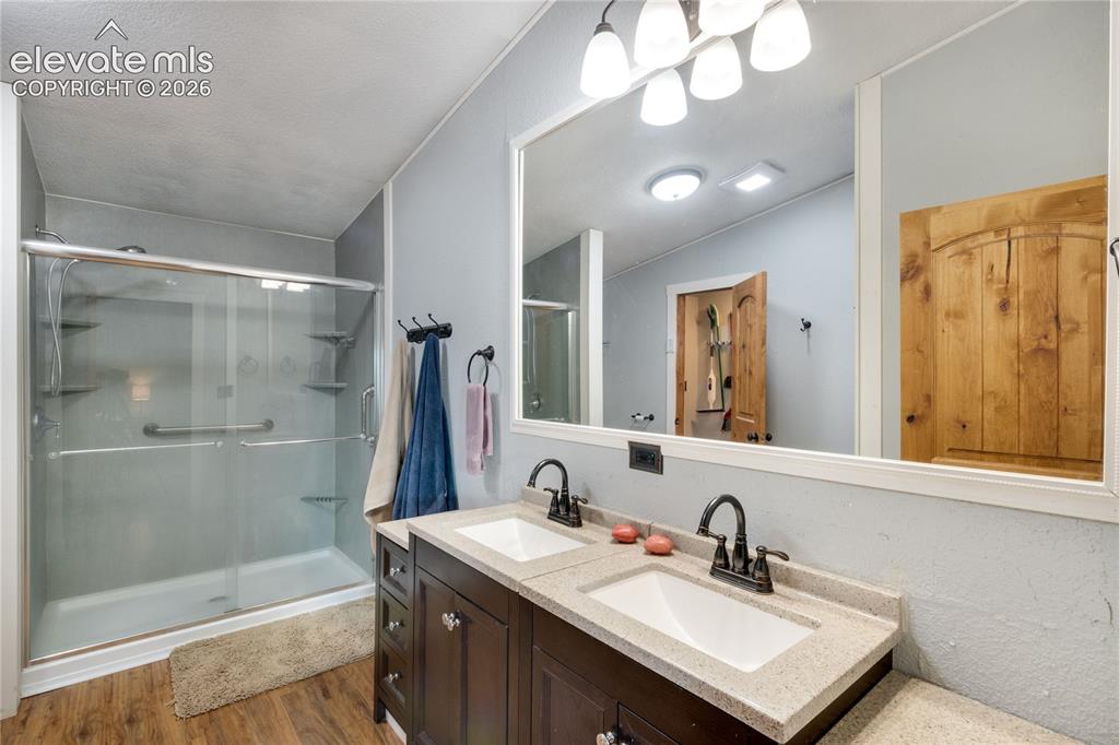 Image 19 of 36: Primary Bathroom with large shower and double vanity. There is lots of coun