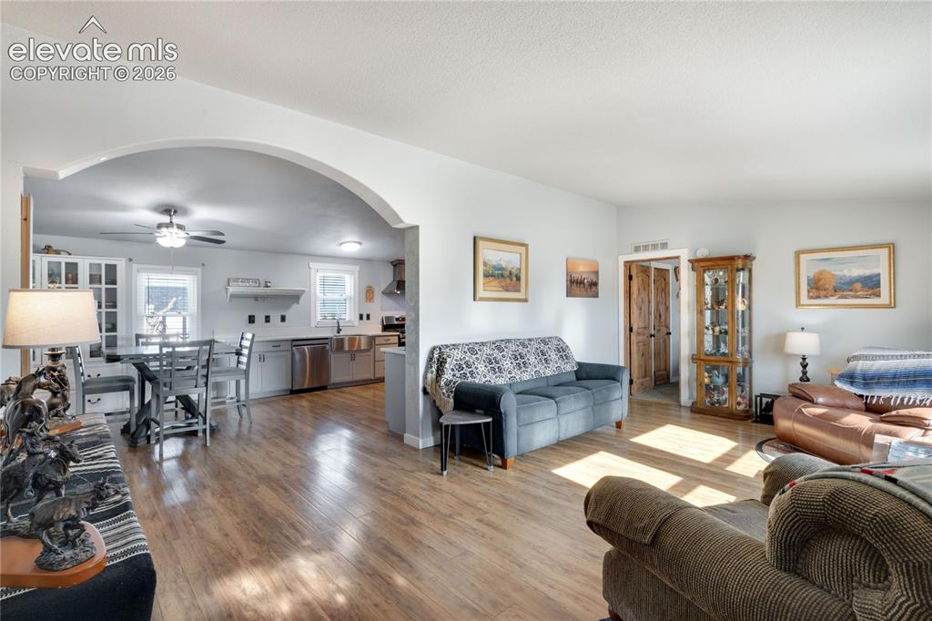 Image 4 of 36: View from the front door looking toward the dining area and kitchen