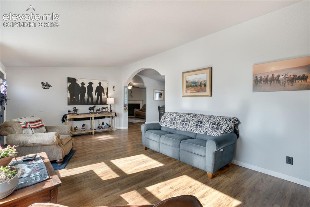 Image 6 of 36: Another view of the Living Room, this one looking toward the Family Room