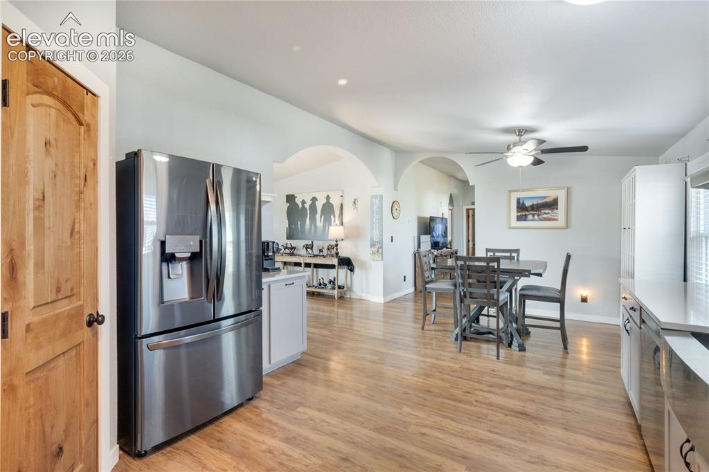 Image 9 of 36: From the Laundry Room and back door, large kitchen with granite countertops