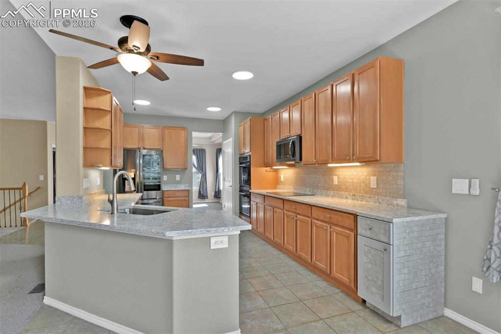 Image 13 of 50: Large kitchen with tile flooring