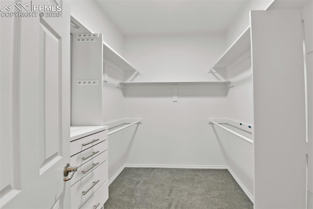 Image 23 of 50: Spacious walk-in closet