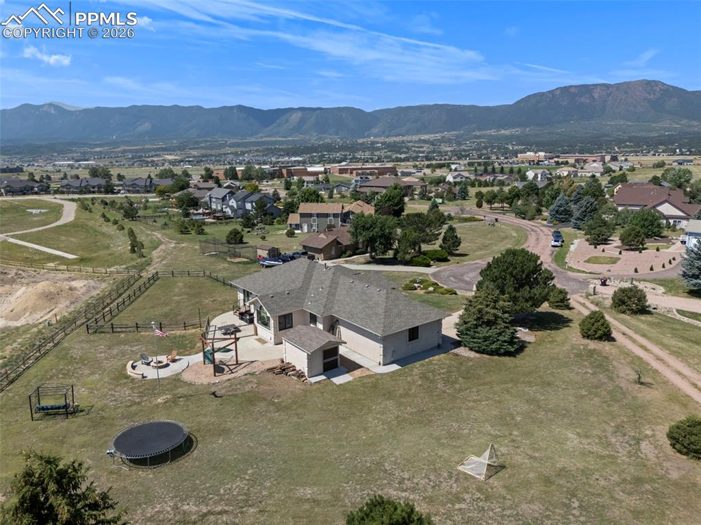 Caption: Aerial view of property and surrounding area with mountains