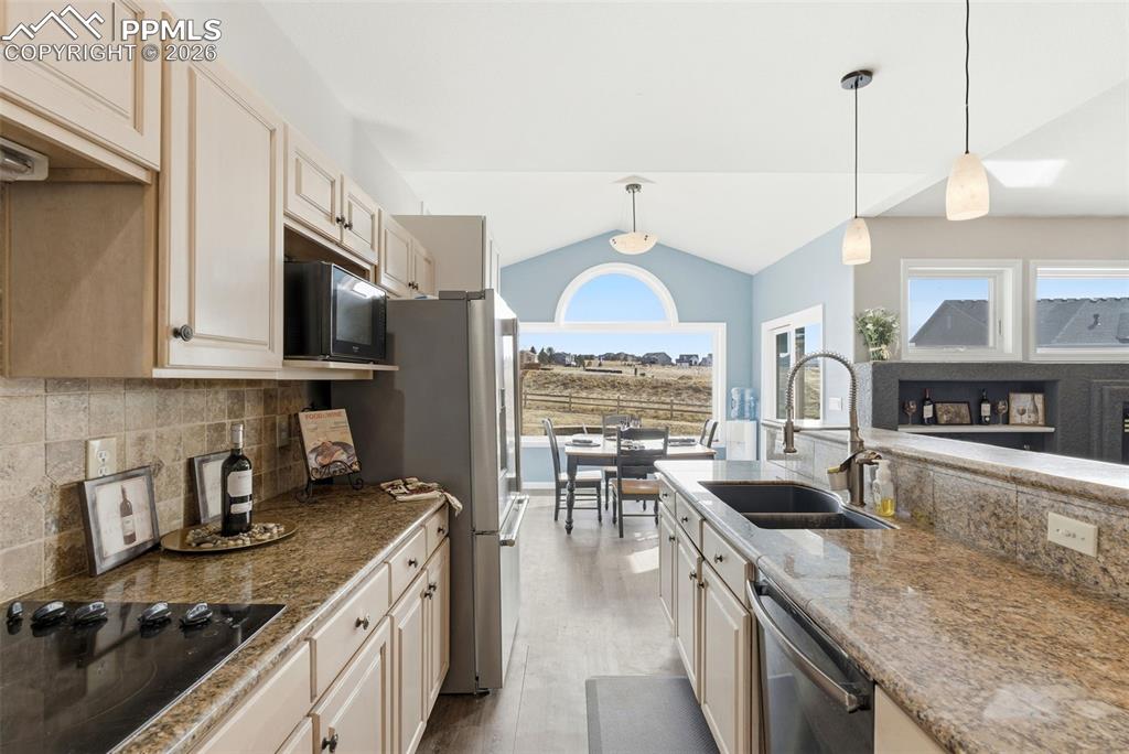 Image 26 of 47: Kitchen flows into Informal Dining Area