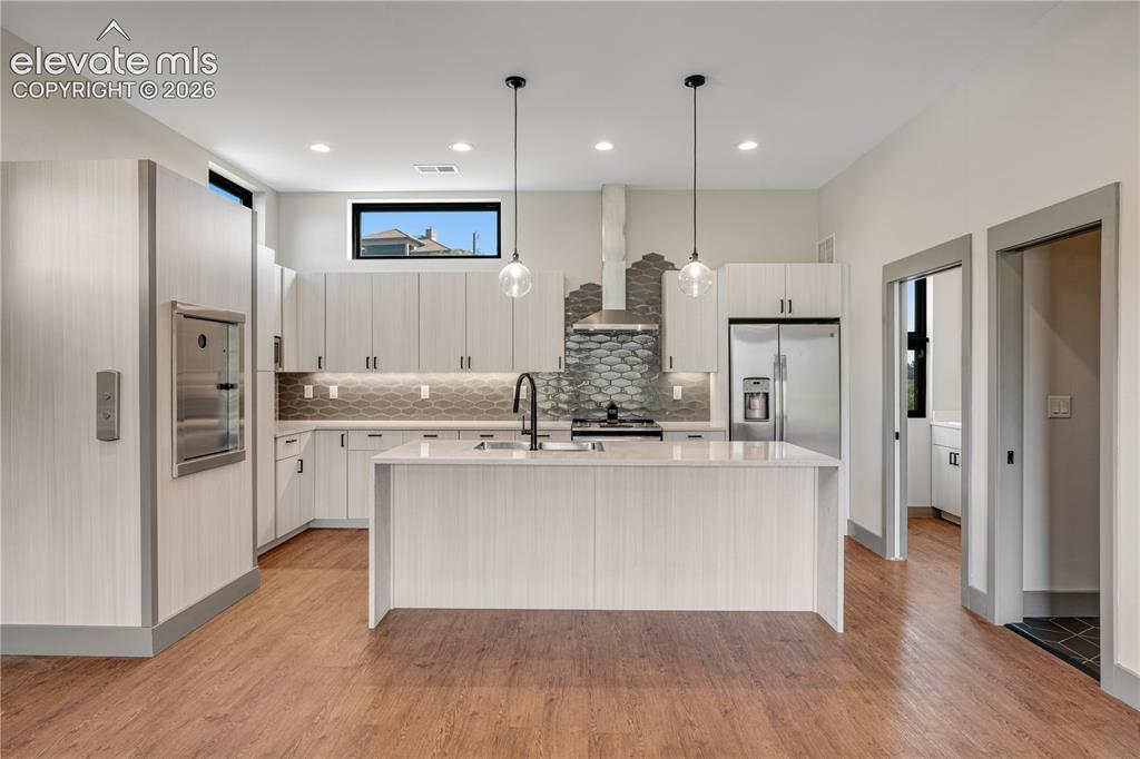 Image 10 of 45: Kitchen with Stainless Steel Appliances