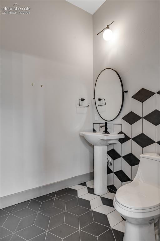 Image 15 of 45: Half Bathroom with Tile Flooring 