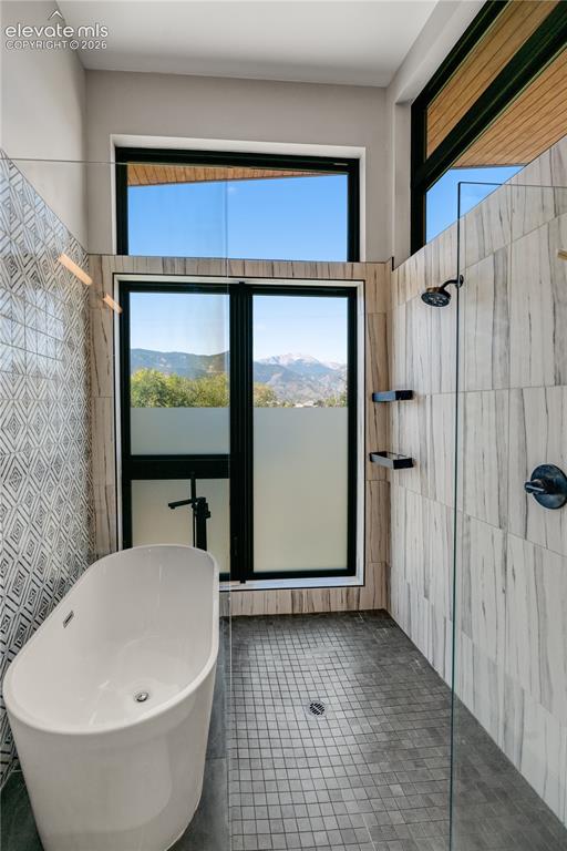 Image 28 of 45: Five Piece Bathroom with Mountain Views