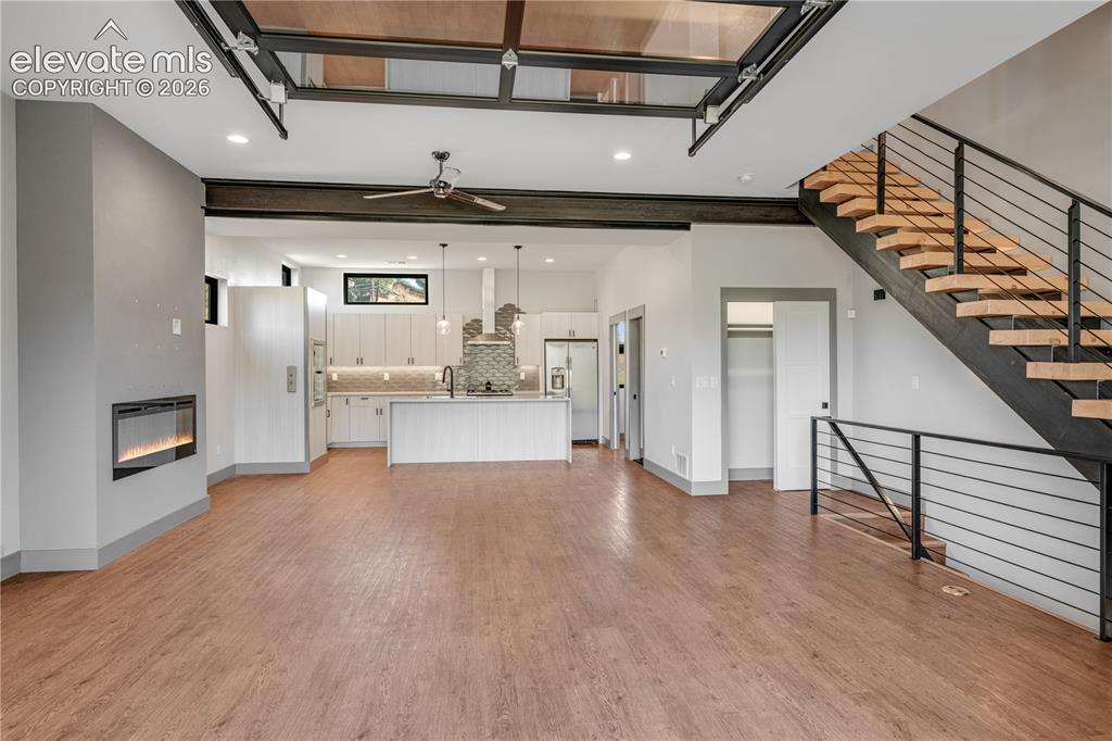 Image 7 of 45: Kitchen with Vinyl Plank Flooring