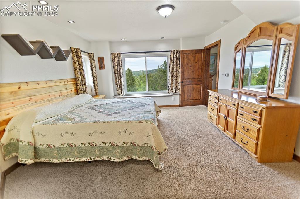 Image 18 of 40:  Upper Level Master Bedroom