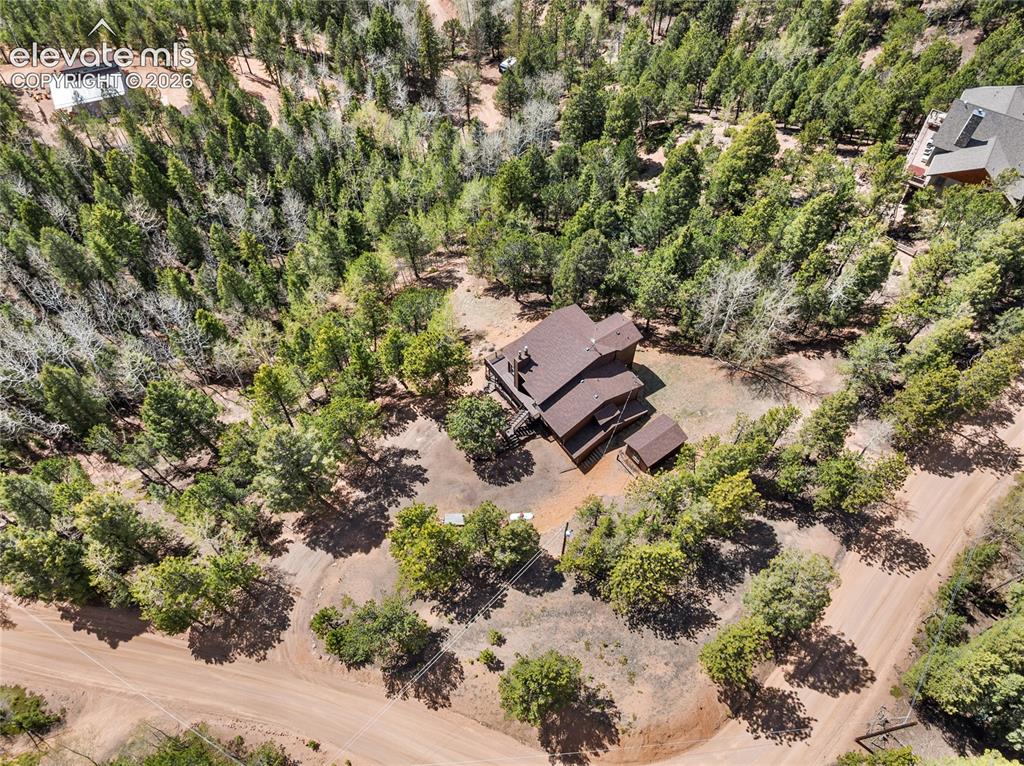 Image 5 of 50: Vaulted ceilings, wood and ceramic floors, and stunning mountain views visi