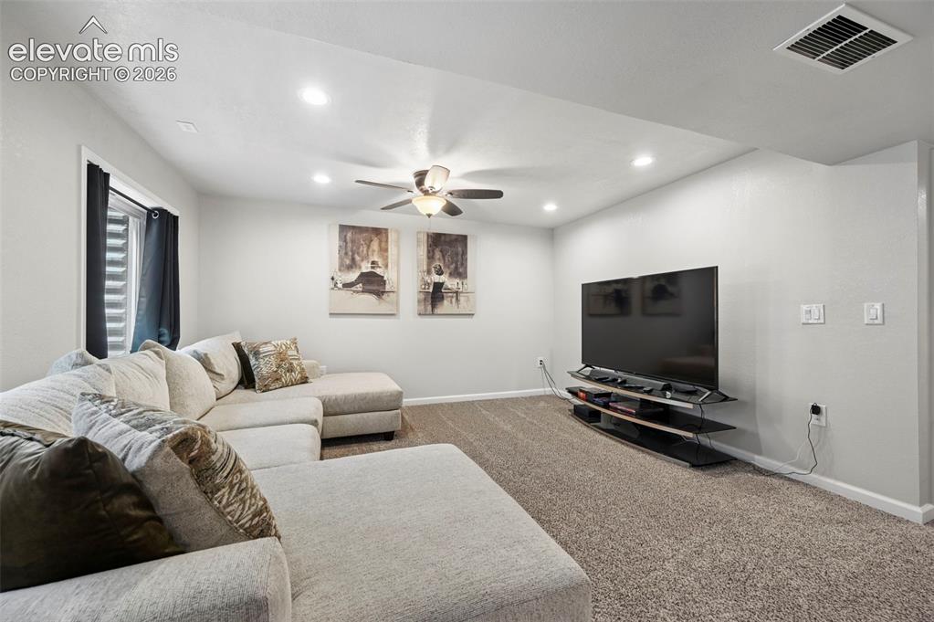 Image 21 of 29: Recessed ceiling lighting, ceiling fan, carpeted flooring, and a window wit