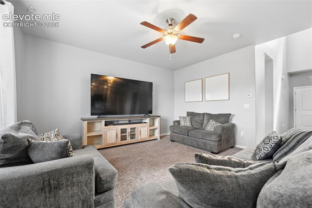 Image 9 of 29: Recessed lighting, ceiling fan with light fixture, light gray walls, carpet