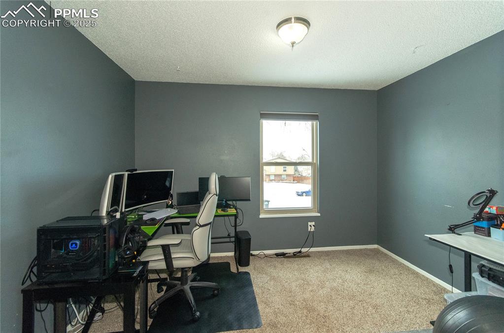 Image 16 of 23: Bedroom currently used as home office