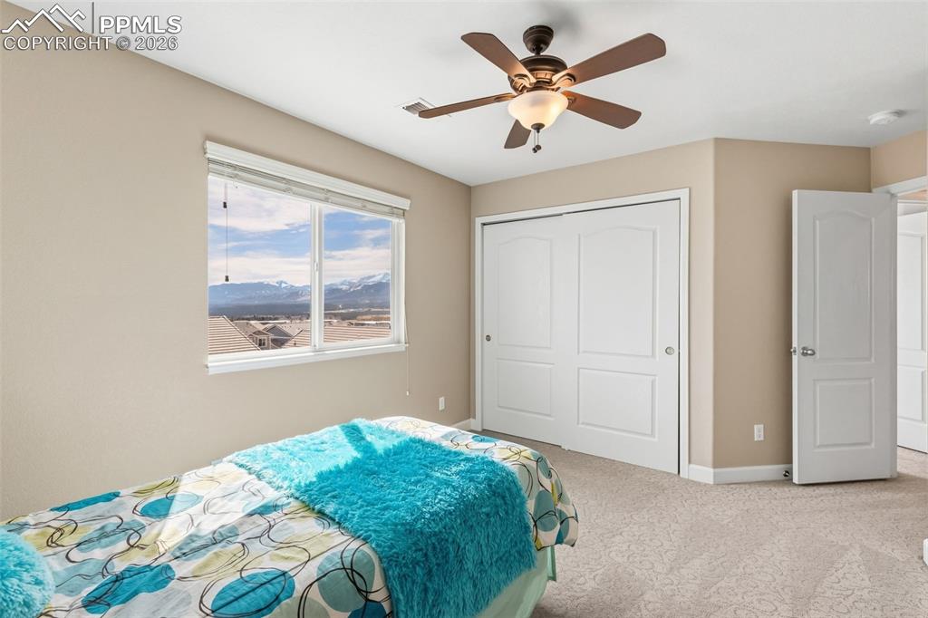Image 18 of 32: Bedroom with Pikes Peak and Air Force Academy views