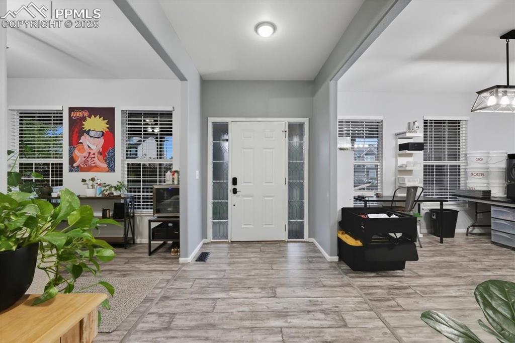 Image 8 of 41: To the right you can enjoy the open dining area that accommodates a park of