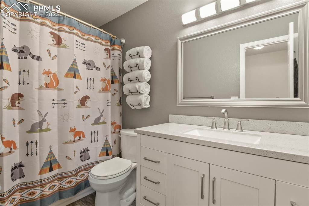 Image 37 of 50: Full tub/shower in the 2nd upstairs bathroom