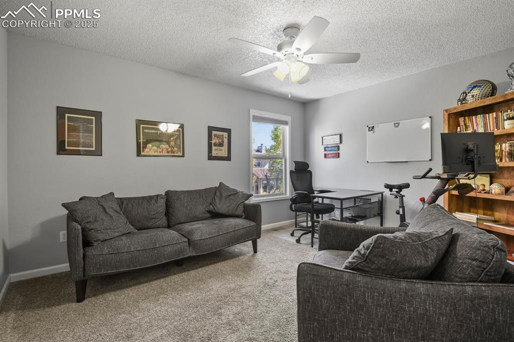 Image 39 of 50: Upstairs bedroom, currently used as an office