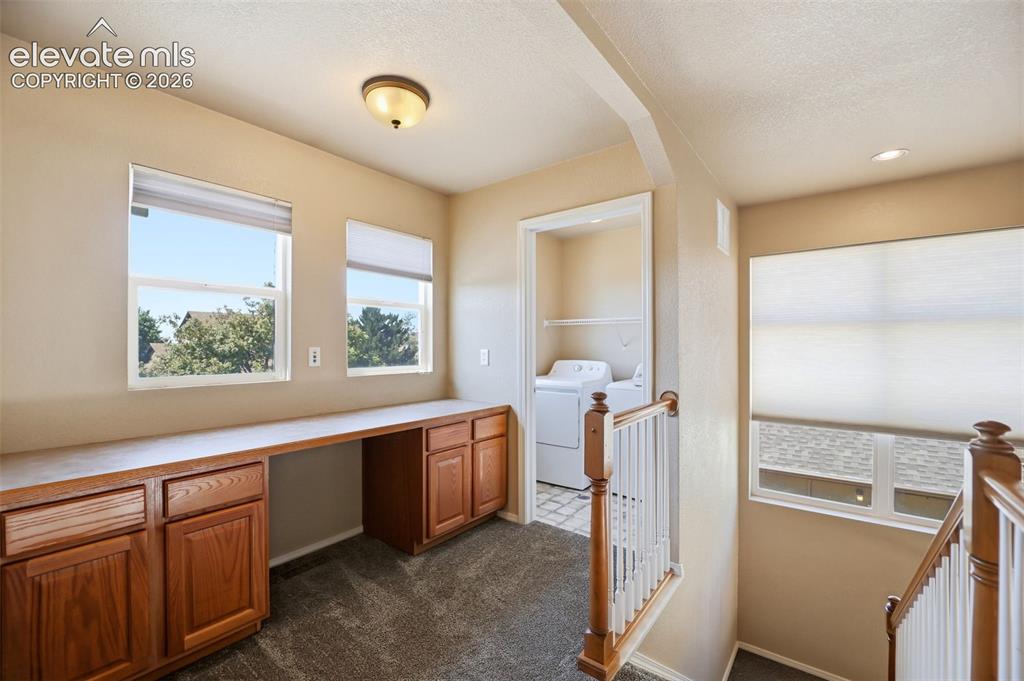 Image 19 of 47: Loft with desk and upstairs laundry room