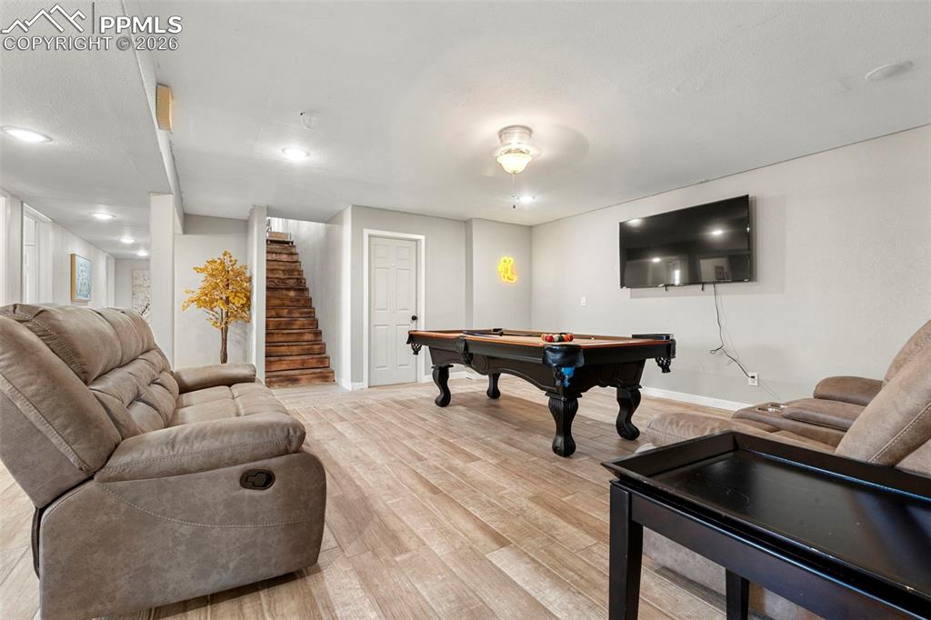 Image 29 of 35: Playroom featuring light wood-style flooring, billiards, and recessed light