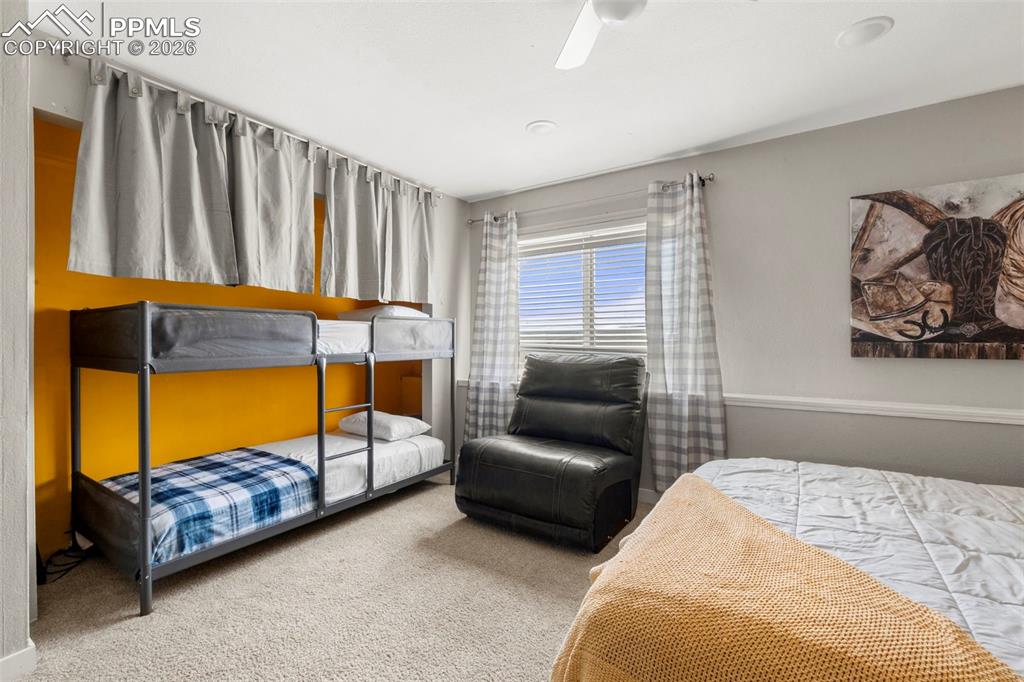 Image 30 of 35: Bedroom featuring light colored carpet and a ceiling fan