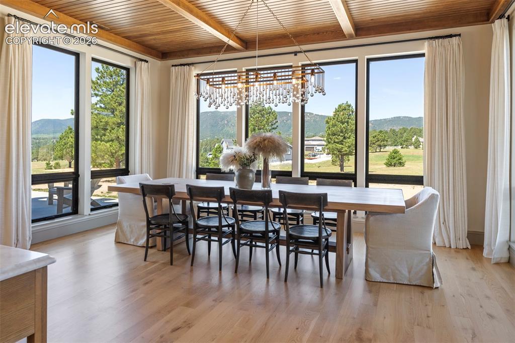 Image 13 of 49: Enveloped in walls of windows that showcase sweeping mountain vistas of Pal