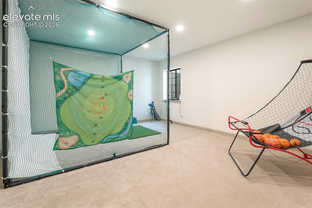 Image 34 of 49: High ceilings perfect for all the game room toys. Open up the living area c