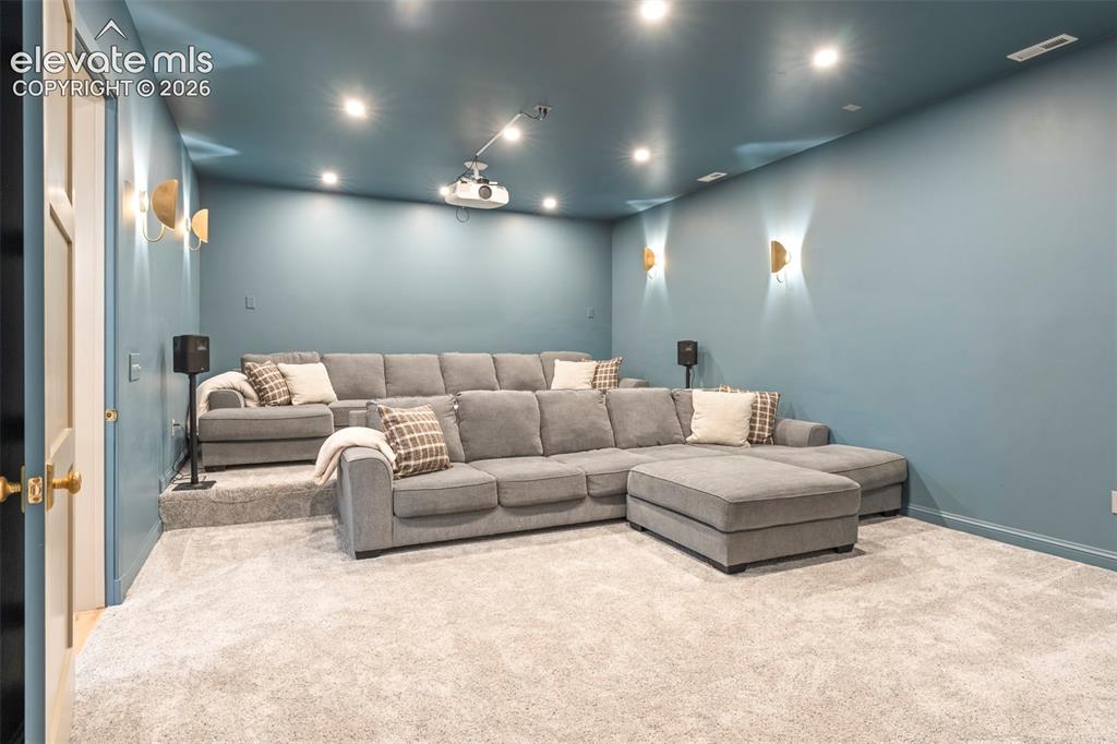 Image 36 of 49: Rich English - inspired theatre sconces, tiered custom platform for stadium