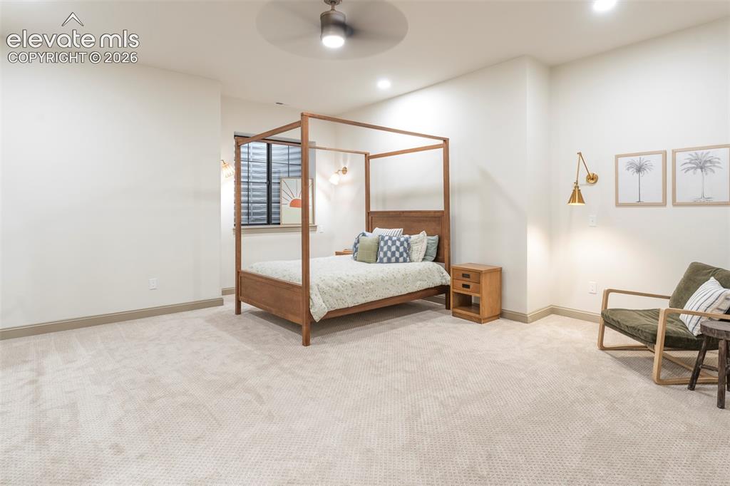 Image 39 of 49: One of three basement bedrooms spacious for family and friends.