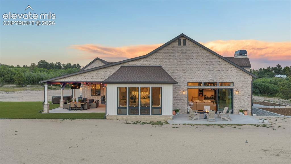 Image 47 of 49: Beautiful rear exterior highlighting the home