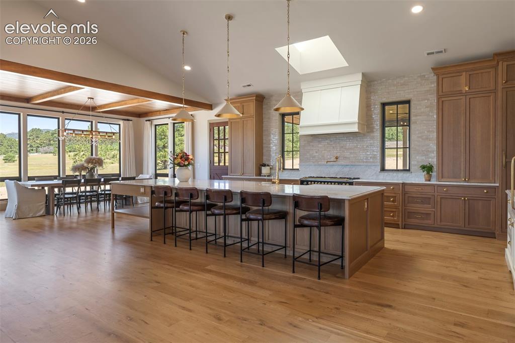 Image 7 of 49: Open and spacious to gather for breakfest at the bar or the table with view