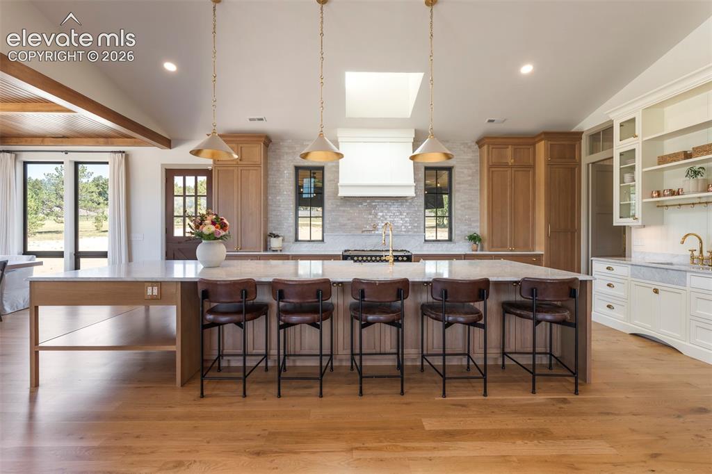 Image 8 of 49: Handcrafted inset rift - sawn white oak cabinetry, 15 foot Carrara Marble c
