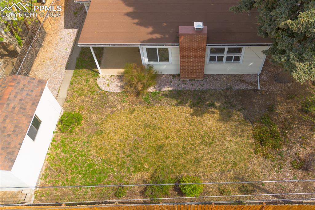 Image 22 of 28: Good sized backyard with 15x8 storage building and access to the front yard