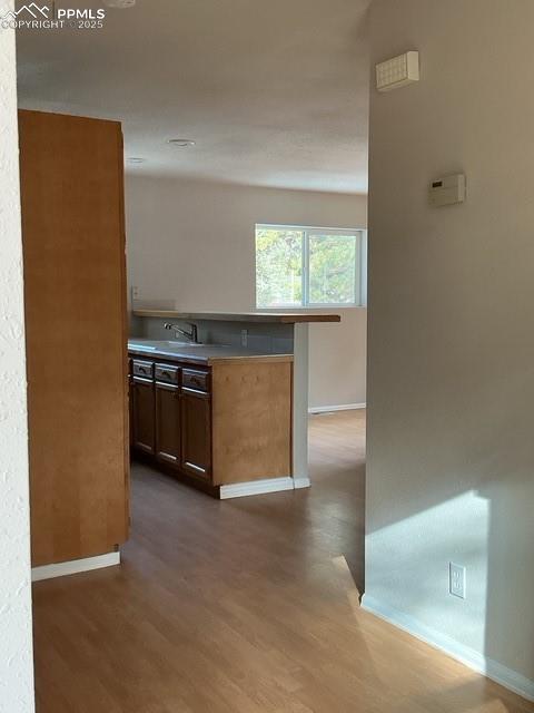 Image 10 of 30: Hall Entrance looking into kitchen dinning area