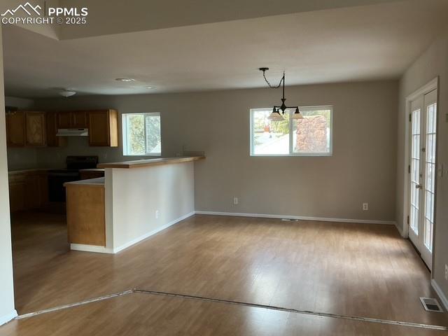 Image 13 of 30: Kitchen / Dinning view from living area