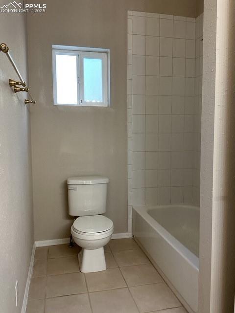 Image 25 of 30: Bathroom featuring light tile patterned floors and shower / washtub combina