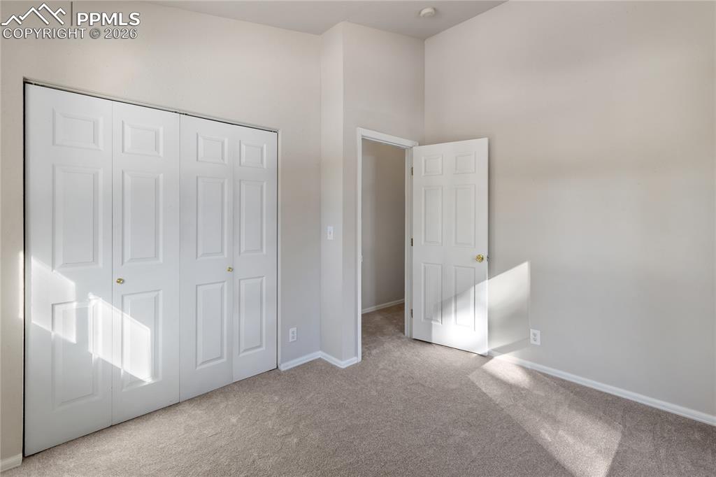 Image 35 of 37: Bdrm #3 looking into hall