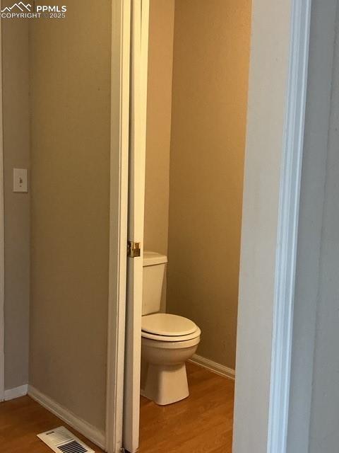 Image 7 of 30: View from Hall entrance Bathroom - Powder room off garage entrance & main