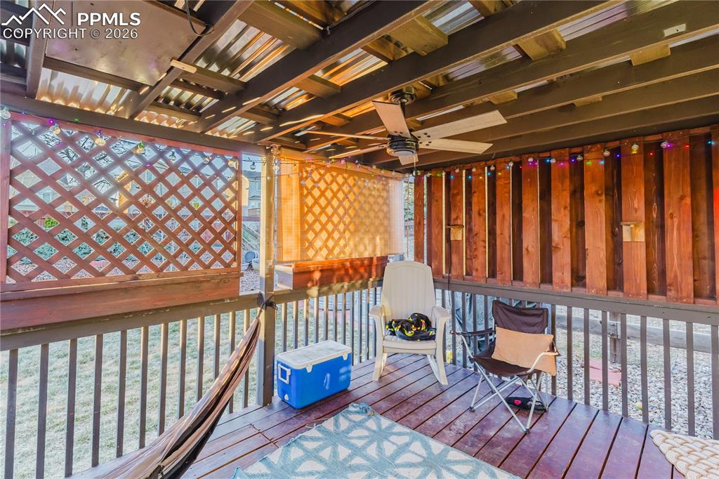Image 3 of 30: Wooden terrace featuring ceiling fan