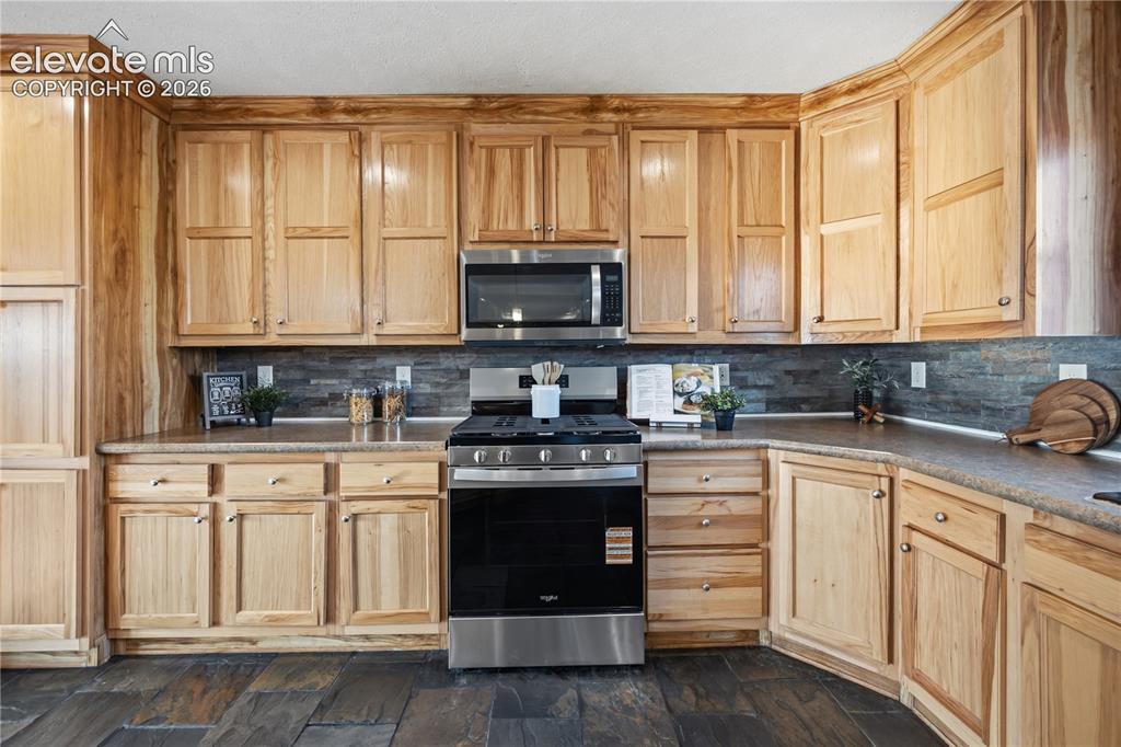 Image 10 of 49: Pantry Cabinet and so much cabinet space!